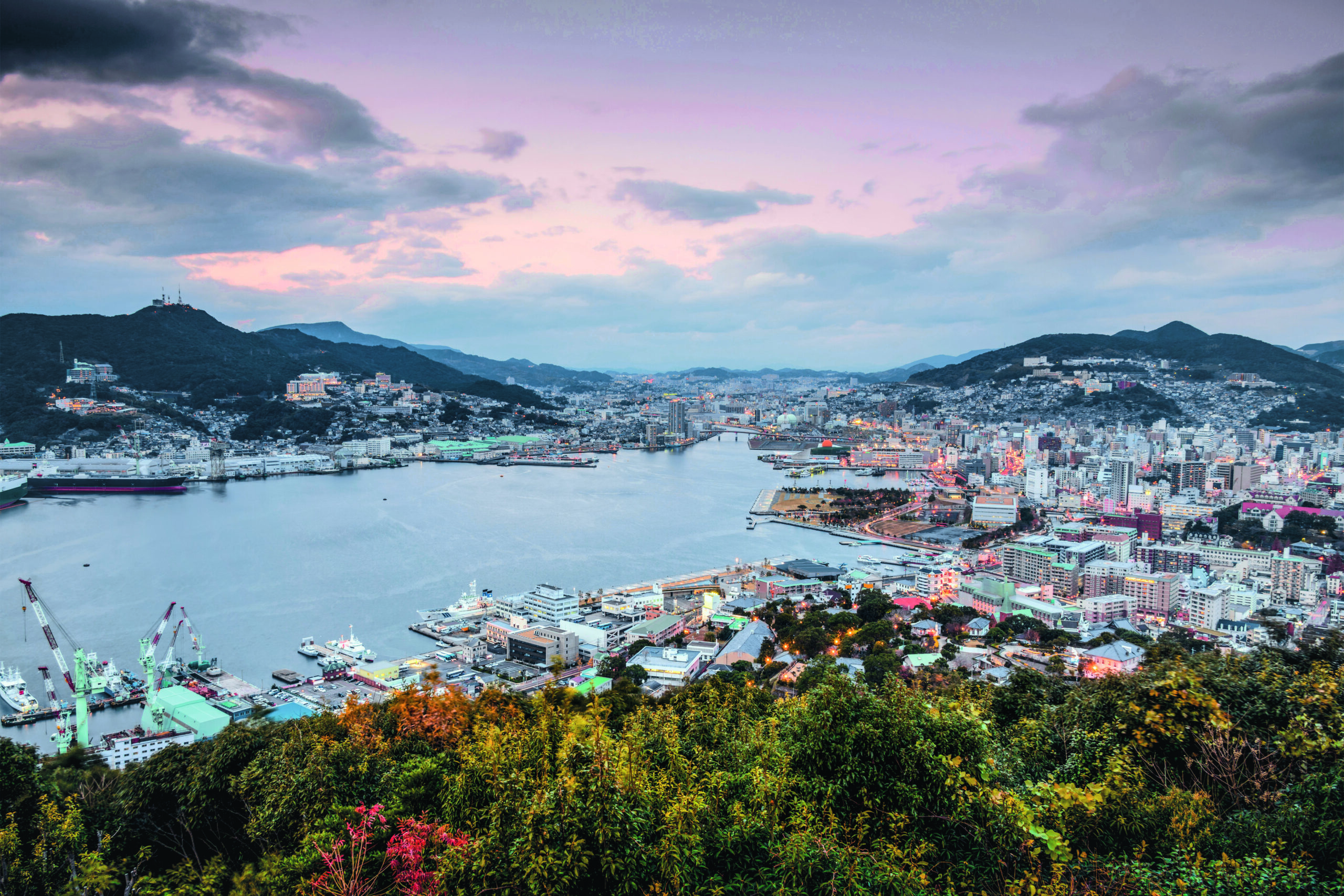 E6NDFR Nagasaki, Japan city skyline at dusk.